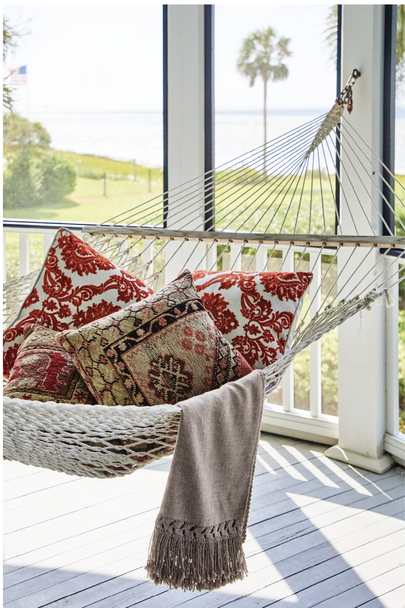 Plump pillows and a soft throw make this hammock an enviable post-meal napping spot.