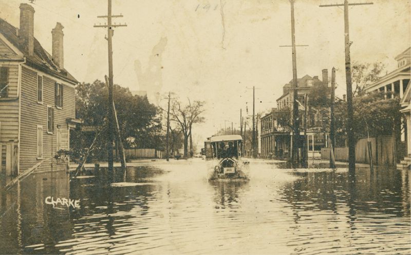 1,000 Years of Floods: As these vintage images show, flooding in Charleston is nothing new. (Above) a pencil marking indicating “1911” suggests this car, sloshing down the street most likely near the corner of Rutledge and Calhoun, was a victim of the September 1911 flood.