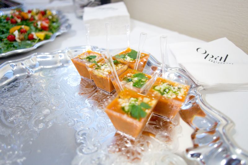 Langdon’s plated miniature bowls of gazpacho.