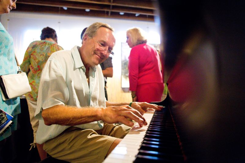 A guests hopped onto the piano at Robert Lange Studios; a sign on the piano reads, “If you can play, play, if you cannot, do not.“