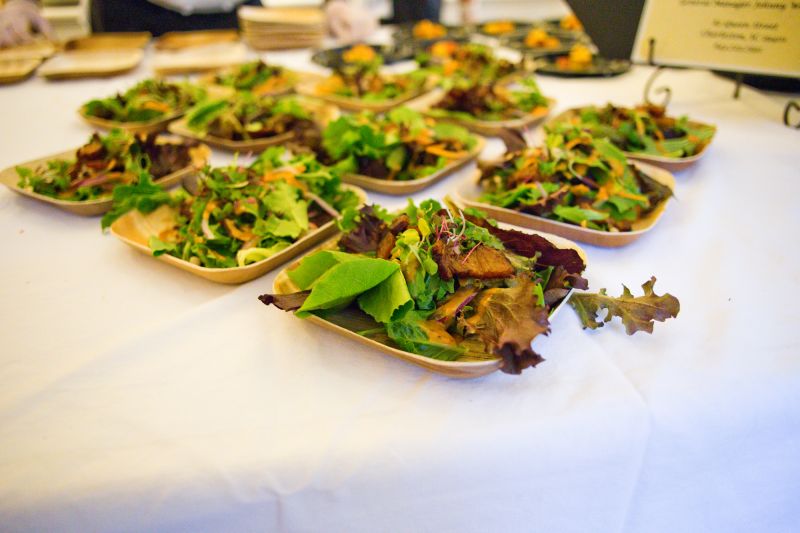 82 Queen plated a salad topped with pork belly.