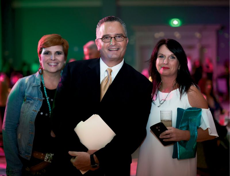 ABC News 4 anchor Dean Stephens, the evening’s emcee,  with two fans. Photo by Jonathan Balliet