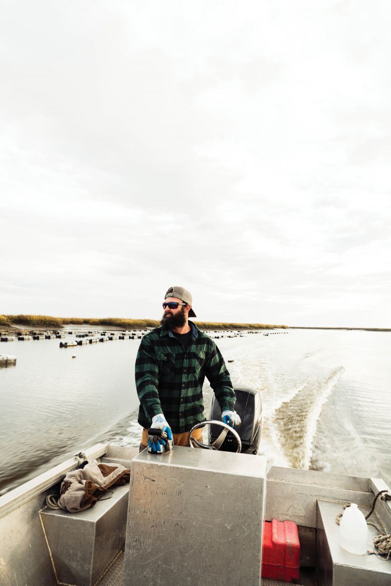 Trey McMillan motors through the ACE Basin, where his Lowcountry Oyster Co. farms select oysters.