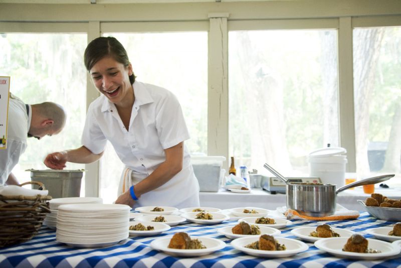 Closed for Business chef Liela Schart dishes up plates of crispy confit turkey wings in a pork belly and fermented chile sauce with caponata verde.