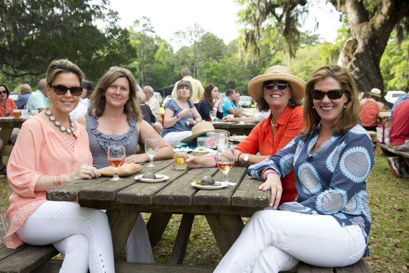 Kristy Dukelow, Gayle Woodward, Charleston magazine club member Chellie Kew, and Lynann Harder enjoy the shrimp burgers from The Ordinary.