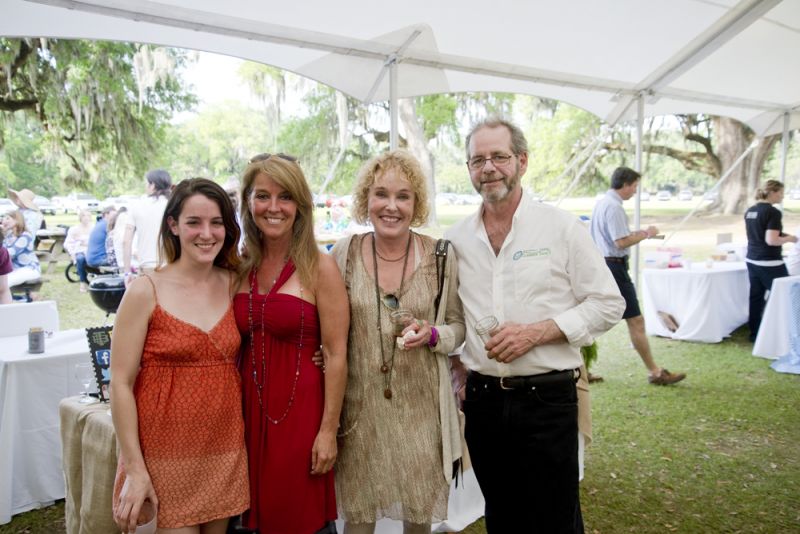 Hannah McCleskey, Laura Hunt, Callie White, and Clammer Dave hang out by the Two Bouroghs Larder table. Clammer Dave is a seafood supplier for the restaurant.