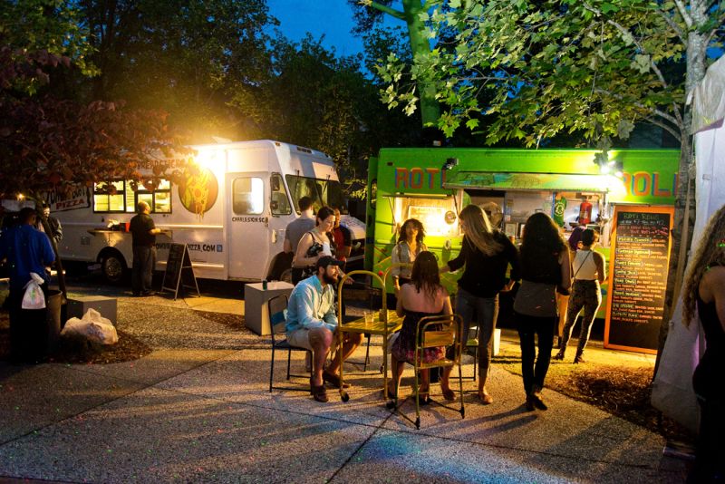 Food trucks Roti Rolls and Zombie Bob&#039;s set up outside to provide eats.