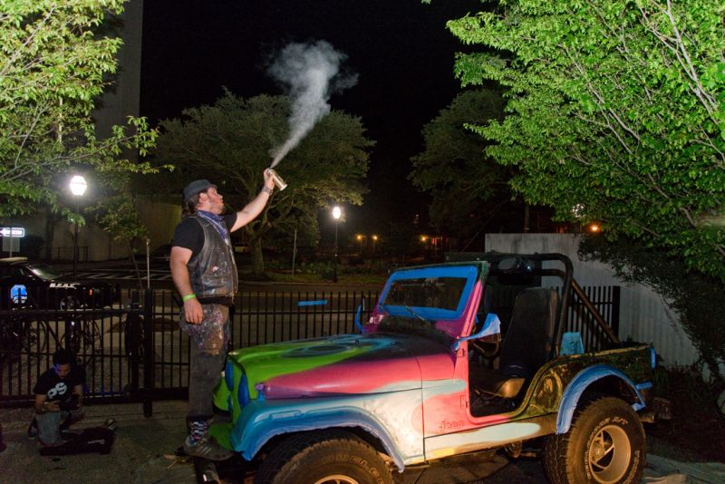 The clowns spray painted a jeep in neon colors.