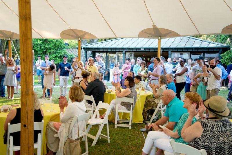 The guests applauded for the top bidder who won a clamming trip with Clammer Dave.