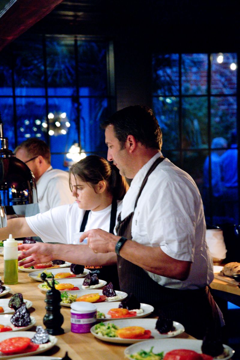 Big chef Kevin Johnson got help with plating from little chef Tiffany Allen.