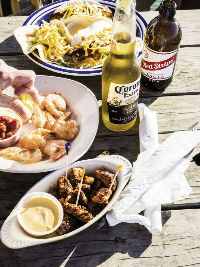 Snag an outdoor table at Sunset Cay for fish tacos, steamed shrimp, and blackened grouper bites.